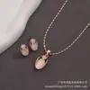 Paquete Individual Ojo de Gato Blanco Cadena de Oro Real Conjunto de Colgante y Aretes para Mujer Collar de Oro Regalo Estilo Nuevo