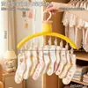Colgador de ropa multi-clip con forma de flor negra para uso doméstico, adecuado para calcetines y ropa interior, herramienta multifuncional pequeña de almacenamiento de ropa