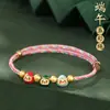 Pulseira de corda colorida zongzi do Festival do Barco-Dragão 2026 novo modelo pulseira trançada artesanal étnica infantil atacado corda vermelha