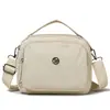 2026 Nova Bolsa de Ombro Feminina Versátil e na Moda Bolsa Quadrada Pequena Simples Casual Bolsa de Tecido de Nylon Resistente à Água
