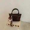 Bolso de Alta Gama Transfronterizo para Mujer 2026 Otoño/Invierno Nuevo Popular Exquisito Bolso de Mano para Viajes Cotidianos Bolso de Hombro Único Cruzado