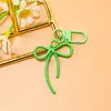 Llavero de lazo de cuentas estilo INS de colores con cinta, colgante de aleación, accesorio para niñas, charm para mochila, accesorio de hebilla para puerta