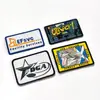 Em30 Ropa Personalizada Bordado por Computadora Autoadhesivo Parche para Chaqueta de Plumas Insignia Bordada con Logo de Letra