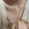 Accesorios de pareja de nicho para celebridades de internet, collar con temperamento de mariposa, collar, moda, sentido de alta gama, cadena para clavícula de perlas, accesorios, venta al por mayor