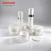 Venta directa del fabricante: botella redonda recta de superficie de diamante acrílico blanco, botella de loción, botella de esencia, botella de crema de 30 ml, material de embalaje de 30 g