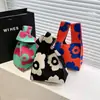 Bolsa de mão de tricô de alta qualidade com retenção automática, blocos de cores retrô, alça de pulso, versão coreana, bolsa de gato, bolsa versátil para mulheres