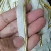 Fornecimento de fábrica preto e branco inferior borda dourada e prateada corda de rolo borda de seda mãe tira de rolo de borda de roupa pode ser cor definida