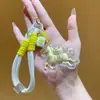 Llavero de Anime Bidimensional Éxito Instantáneo Dibujo Animado Hazte Rico Inmediatamente Cadena para Teléfono Colgante de Bolso Decoración para Coche