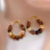 Brincos Olho de Tigre Estilo Melanoid Retro Senso de Design de Nicho Brincos Versáteis Luxo Leve Moda de Alta Qualidade Brincos de Tarraxa para Mulheres