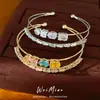 Pulsera abierta de doble capa de oro real de 18k chapado con circonita redonda y cuadrada, simple y elegante, joyería de nicho de lujo ligero