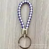 Llavero de cuerda de cuero trenzado simple creativo colgante de muñeca linda accesorios de llave para parejas tendencia regalos pequeños venta al por mayor