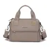 Bolsa Impermeable de Tela Oxford para Mujer 2025 Nueva Bolso de Mano Bolso de Lona Simple Versátil Bolso Cruzado de Hombro con Múltiples Bolsillos