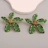 Europa y Estados Unidos nueva moda personalidad temperamento creativo transfronterizo pendientes de flor de aceite pendientes exagerados de punto de onda de aleación para mujeres
