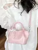 Bolso pequeño simple y elegante para mujer, nuevo bolso tipo cubo verano 2026, bolso cruzado de color sólido texturizado de moda para mujer