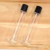 Venta al por mayor en stock, botella de perfume de bayoneta, embalaje de cosméticos, botella de vidrio vacía cilíndrica para aromaterapia, botella con atomizador de 100 ml