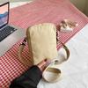 Bolso pequeño y ligero para mujer, novedad primavera 2024, bolso de hombro de lona de moda, pequeño y exquisito mini bolso bandolera para teléfono móvil.