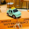Juguete de coche de aleación creativa de retroceso llavero de coche de dibujos animados colgante para mochila escolar estudiante regalo pequeño para parejas venta al por mayor