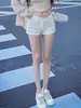 Shorts de Mezclilla Blancos de Cintura Baja Little Spice Girls para Mujer 2025 Nuevo Verano Elásticos Adelgazantes Versátiles Cadera Hot Pants