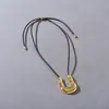 Nuevo Colgante de Metal con Esmalte Irregular de Goteo Forma de U Cadena Larga de Cuerda de Cuero Negro Cadena para Suéter Estilo Simple Ins Collar Versátil