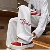 Calça Esportiva Listrada Estilo Americano para Homens, Nova Primavera e Outono High Street Solta com Caimento Reta de Perna Larga Casual Longa para Exportação