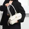 Bolso de axila de moda transfronterizo de lujo ligero para mujer, nuevo bolso baguette de nicho estilo francés con un toque vintage de alta gama, bolso de mano de un solo hombro