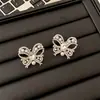 Clip de Hueso de Oreja de Perla con Lazo de Diamante Estilo Coreano Pendientes de Moda Elegantes de Gama Alta Diseño de Nicho Pendientes Versátiles