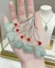 Colgante de la Suerte del Caballo Jade Verde de Tian Shan Riqueza Instantánea Colgante de Caballo Artesanía Fina 3D Colgante de Collar de Seda Dorada y Jade Venta al por Mayor