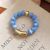 Pulseira Elástica de Contas Redondas Acrílicas Transfronteiriça Europeia e Americana Moda Versátil para o Dia a Dia Design de Pequeno Nicho Joia de Mão