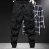 Primavera e Outono Nova Crock Calças Masculinas Moda Marca Perna Solta Montanhismo ao ar livre Tático Estilo Americano Multi-Pocket Calças Casuais