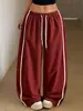 Calça feminina larga transfronteiriça com tira lateral color blocking, cintura elástica com cordão, comprimento até o chão fluida, estilo de rua, corte solto, calça esportiva