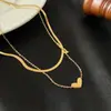 Collar Clásico y de Moda Apilado Doble Capa Corazón para Mujer Diseño de Alto Nivel Nicho Lujo Ligero Cadena para Clavícula Cadena Hueso de Serpiente