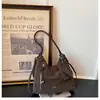 Mochila de un solo hombro y doble hombro para mujer, nuevo modelo otoño 2026, bolsa de axila popular para el día a día, mochila para estudiantes universitarios, bolsa tote