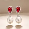 Pendientes Huajie Estilo Coreano Elegantes de Diamantes Rojos y Perlas Artificiales Versátiles para Vestidos y Banquetes Pendientes de Boda Nuevo Estilo Transfronterizo