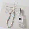 Nueva cadena de móvil con cuentas accesorios de estrella de mar de cerámica cordón para móvil cuerda para móvil femenina azul claro transfronteriza