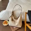 Bolsa de ombro de lona para estudante para a aula, novo modelo versátil 2026, grande capacidade, estampa de letras feminina, bolsa tote casual para o trabalho