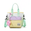 Bolsa de cubo versátil de retazos de colores macarrón, linda y elegante, para niñas, nueva bolsa cruzada colorblock ligera 2026, moderna