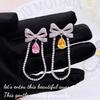 Novo Bow Pink Water Drops Tassel Brincos Girly Sweet e Fácil de Combinar Super Fada Chanel Brincos de diamante amarelo