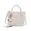 Bolsa transversal de ombro único com laço doce estilo coreano para mulheres, design de nicho, bolsa de mão de cor sólida, mochila moderna e versátil