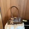 Bolso Nuevo de Mujer Otoño 2026 Alta Apariencia Bolso de Mano Versátil para Viajes de Negocios Capacidad Media Cremallera Bolso de Hombro Único Cruzado
