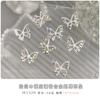 Aleación hueca mariposa arte de uñas joyería estéreo diamante blanco perla metal plata decoración de uñas diamante flash