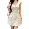 Elegante vestido de lunares estilo francés con cuello de muñeca para mujer, entallado en la cintura, sin mangas, con lazo y bolsillos, vestido corto acampanado adelgazante