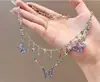 Cadena para Clavícula Doble Capa Estilo Mariposa Super Hada con Diamantes Brillantes, Borlas de Gota de Agua, Collar de Cerezas y Cadena Múltiple con Colgante de Cruz