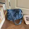 Bolso de Mezclilla Lavada Color Sólido Casual Sencillo Retro para Viajes Cotidianos 2026 Nuevo Moderno Bolso de Hombro Cruzado con Textura