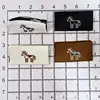 Venta Directa de Fábrica de Etiquetas Tejidas de Caballo del Año Nuevo, Etiquetas Parche, Accesorios para Ropa, Decoraciones para Zapatos y Sombreros, y Decoraciones para Bolsos