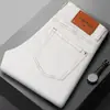 Marca europea de alta gama de moda, nuevos jeans ajustados skinny elásticos para hombre de otoño e invierno con forro polar y diseño engrosado