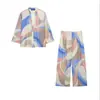 Ropa europea y americana para mujer transfronteriza, top casual a rayas de moda más vendido en AliExpress con detalle de nudo + pantalones de pierna recta