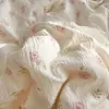Juego de cuatro piezas de algodón de gasa de doble capa con sensación de nube al por mayor del fabricante, sábana y funda de edredón de gasa arrugada ultrasuave, juego de tres piezas para dormitorios de estudiantes