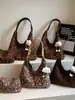 Bolso tote de gran capacidad con estampado de leopardo de moda, diseño de nicho coreano, bolso de hombro y axila elegante y a la moda para ir al trabajo