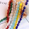 Una gran cantidad de accesorios para el cabello de bricolaje al por mayor, accesorios con agujeros rectos y agujeros verticales, cuentas sueltas de cristal de vidrio artificial.