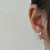 Nuevos aretes de tuerca de flor de campana de viento con lazo s925ins estilo ins temperamento nicho de alta gama aretes hipoalergénicos para mujer